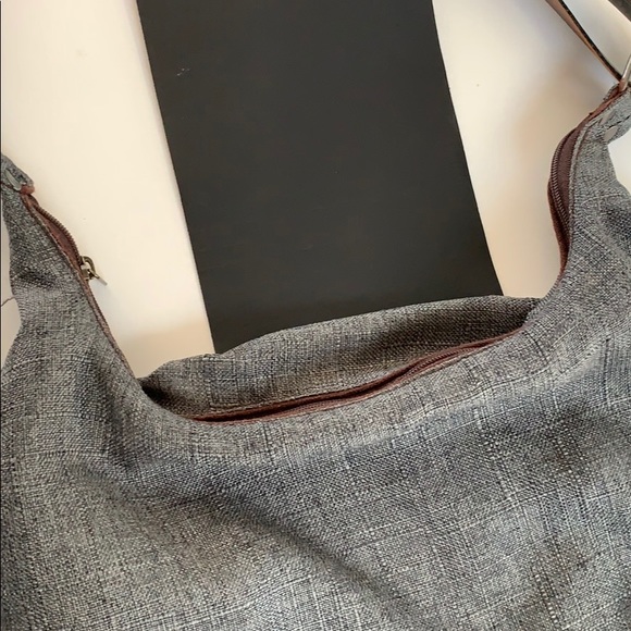 Leather strap and front clasp. Zippers shut. - Picture 5 of 5